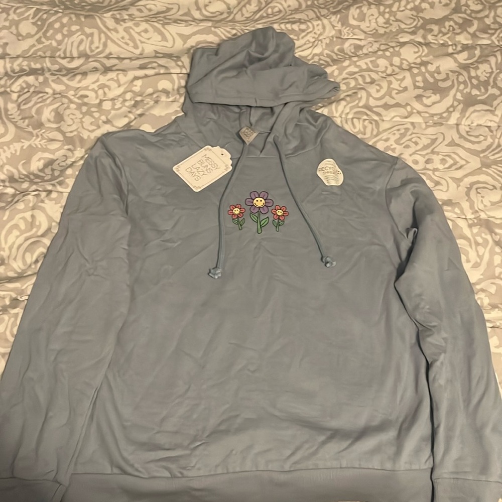 Vintage-ish soft thin light blue hoodie with smiling flowers